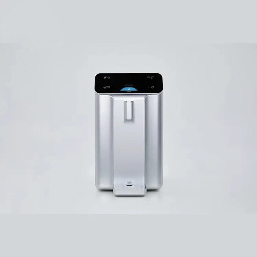 Silver countertop atmospheric water generator, straight-on front view with removable drip tray