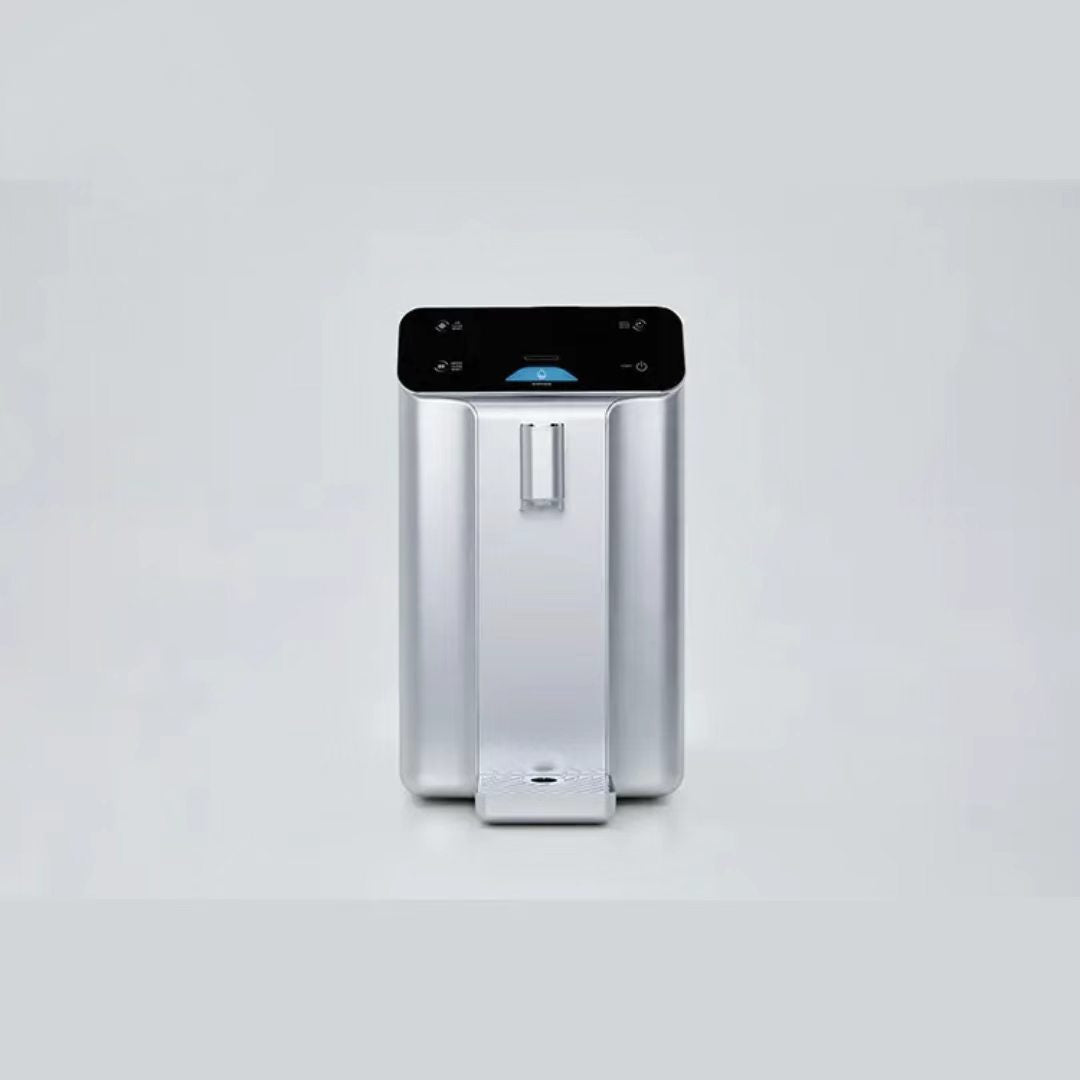 Silver countertop atmospheric water generator, straight-on front view with removable drip tray